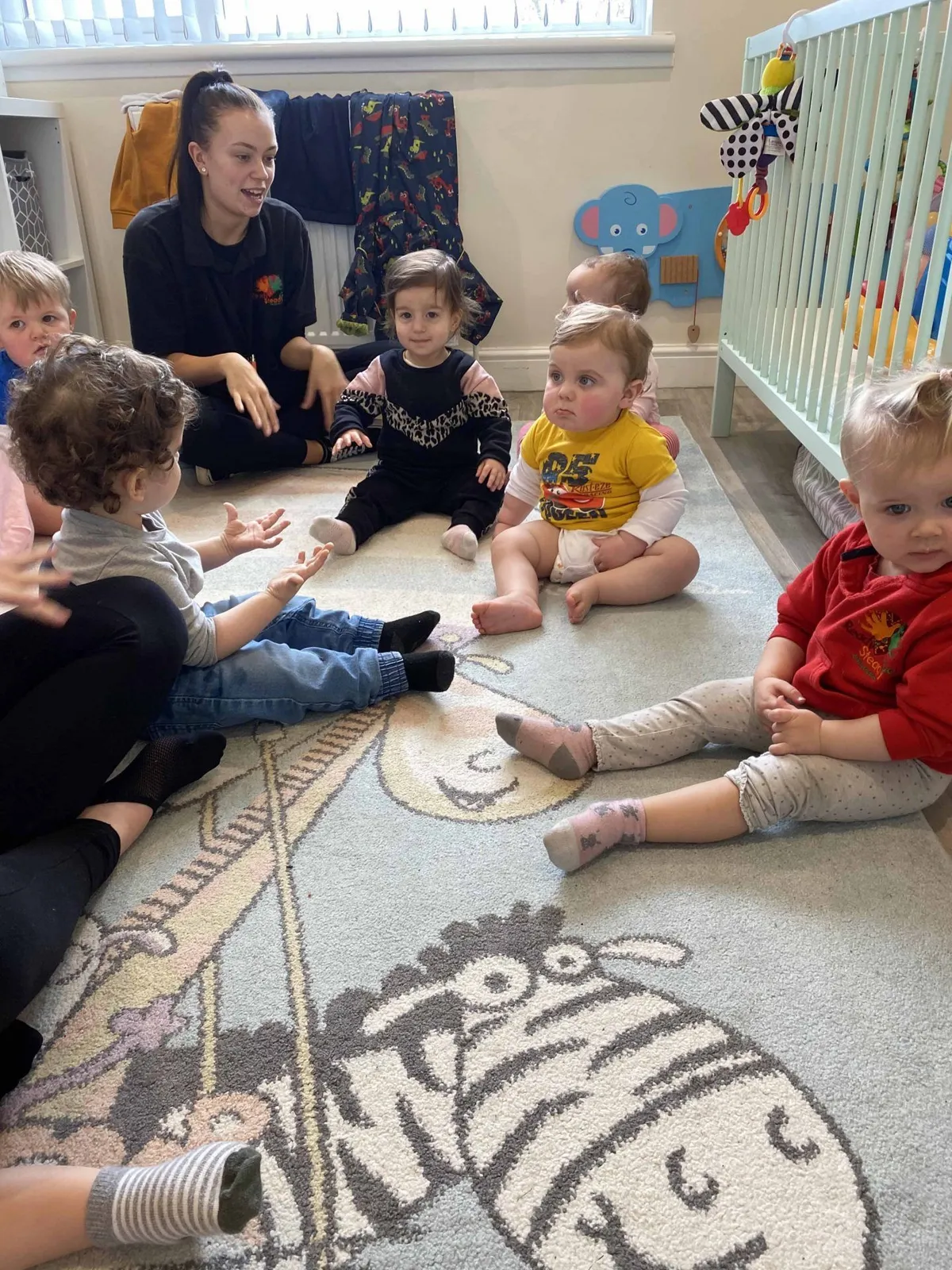 Nursery children enjoying an activity in the garden at Ready Steady Go Childcare Worle