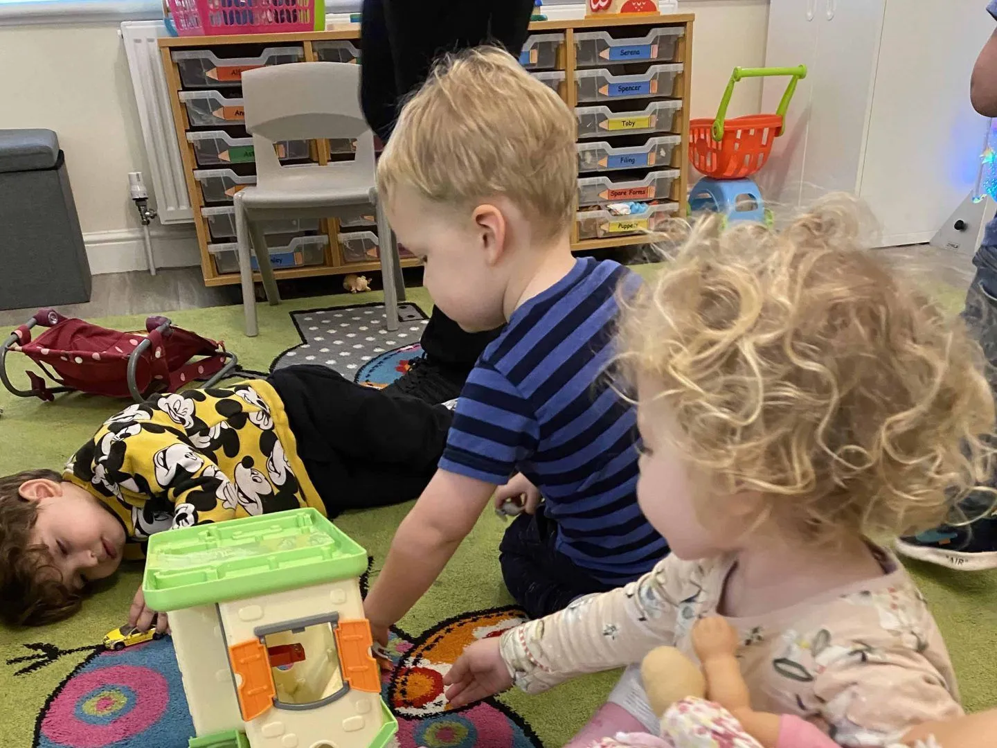 Nursery staff and children playing together at Ready Steady Go Childcare Weston-super-Mare