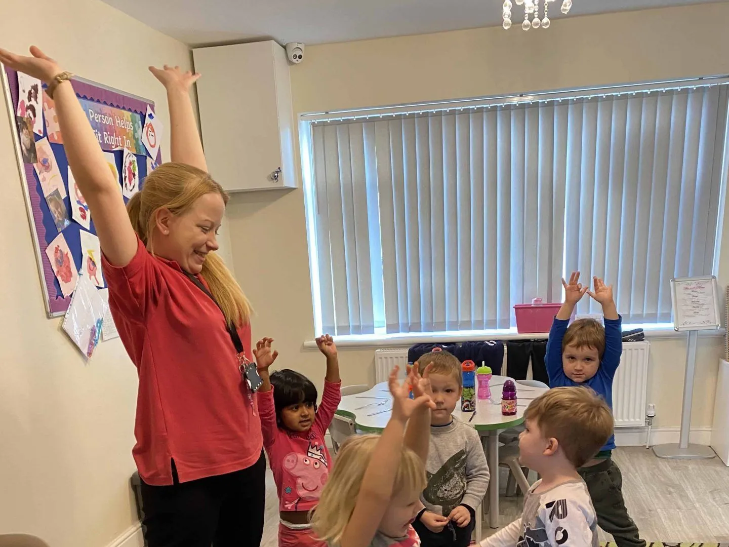 Nursery practitioner supporting a child's learning at Ready Steady Go Childcare Worle