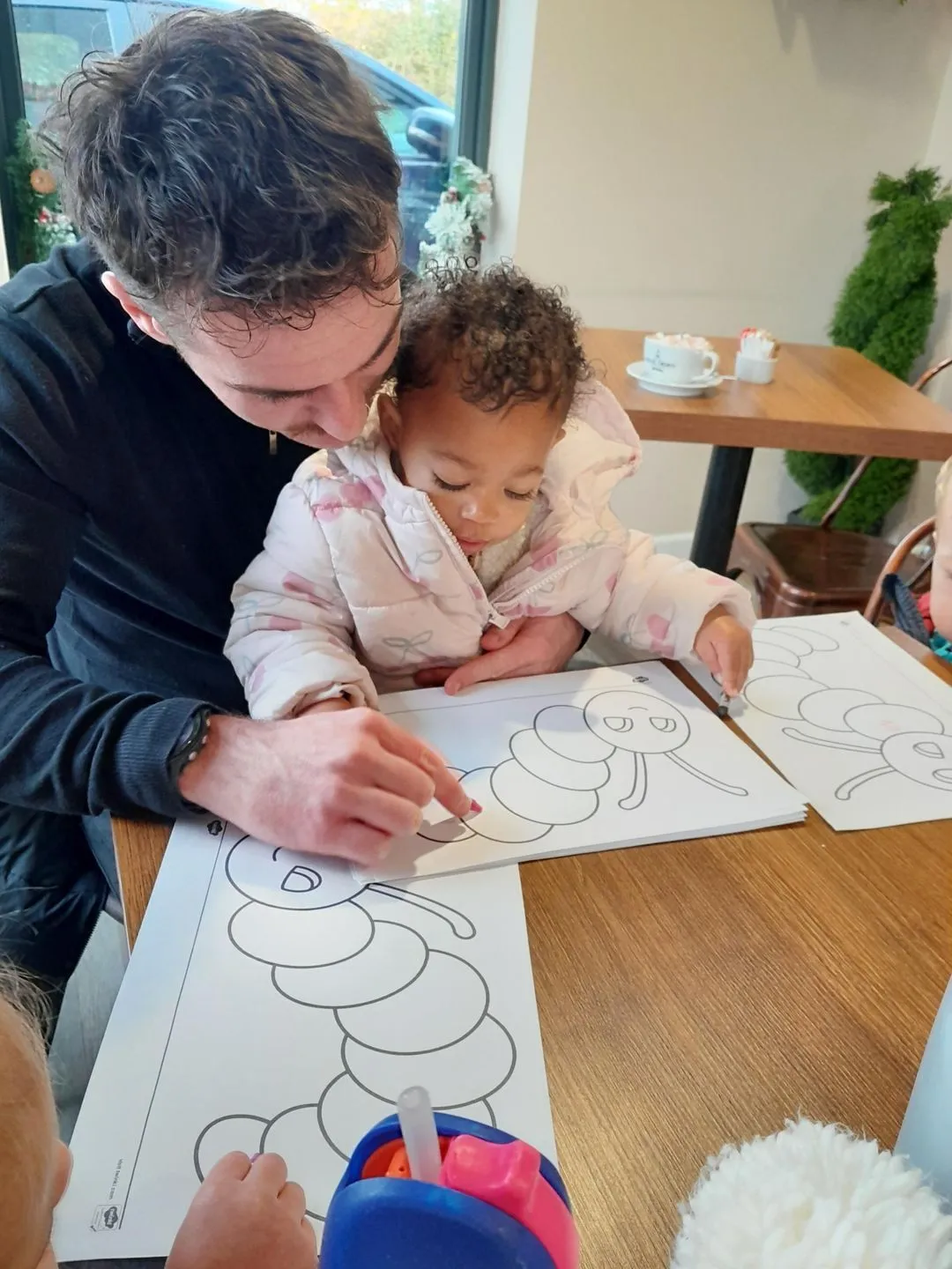 Child colouring during a preschool outing with Ready Steady Go Childcare
